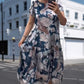 👗Nowość na wczesne lato✨Luźna sukienka w kwiaty z okrągłym dekoltem i krótkim rękawem
